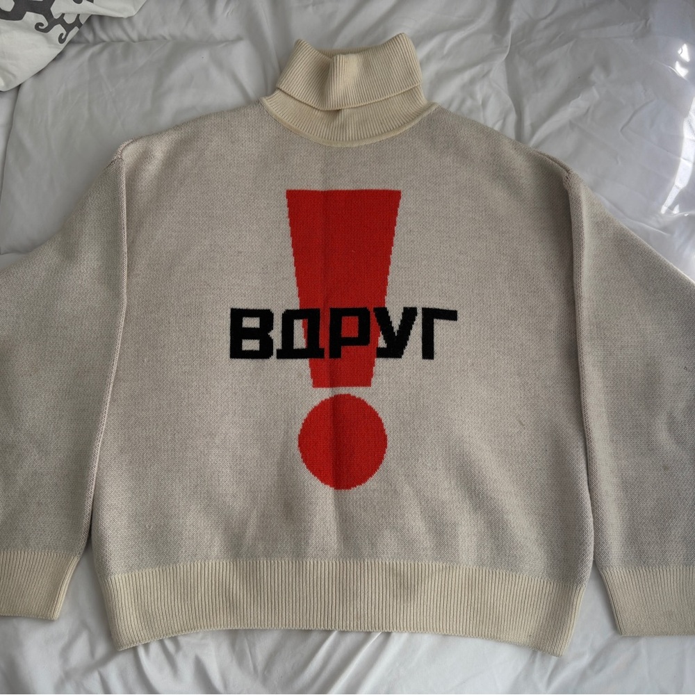 Gosha Rubchinskiy 
Turtleneck Sweater with Red Exclamation Design
